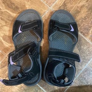 Size 6 light purple and black khombu Sandals